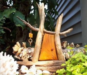 These one-of-a-kind Beachcomber Fairy Doors are made of up-cycled, found woods and pieces of driftwood, and adorned with found objects. No two doors are alike. These doors are designed to lean up against a fence, tree trunk, planter, or wall. - GardenFairies.ca