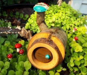 Hobbit Holes… the rarest of them all! Made from magnificent branches, they seem to like to mix brightly-colored earth tones with the natural beauty of wood. These doors are ALWAYS round. - GardenFairies.ca