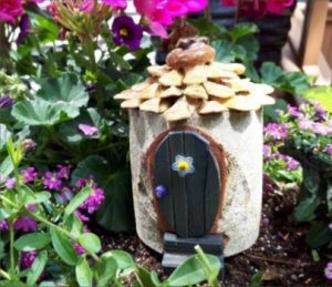 Woodland Fairy Doors are smaller than our Garden Fairy Doors, as they are tiny doorways carved into sections of tree trunks and branches. Their architecture seems to favor and follow the shapes created by Mother Nature. They are particularly fond of pinecone roofs, but as far as color, materials and adornment – anything goes… there doesn’t seem to be any rhyme or reason… but they are gorgeous, whether for inside the house, or out in the garden! - GardenFairies.ca